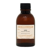 Brown bottle of Co. Bigelow Musk body wash on a white background