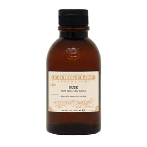 Brown bottle of Co. Bigelow Musk body wash on a white background